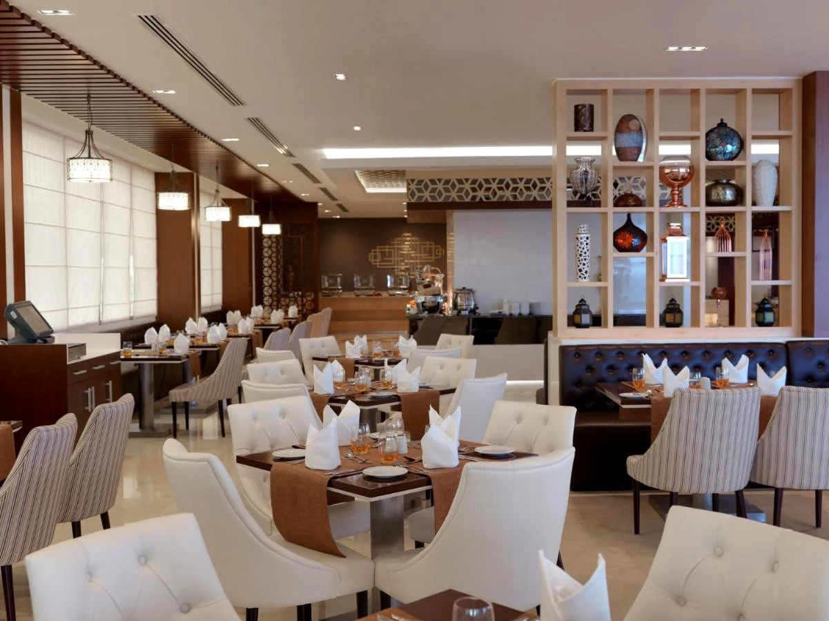 Elegant dining area at Two Seasons Hotel, Dubai with modern decor.