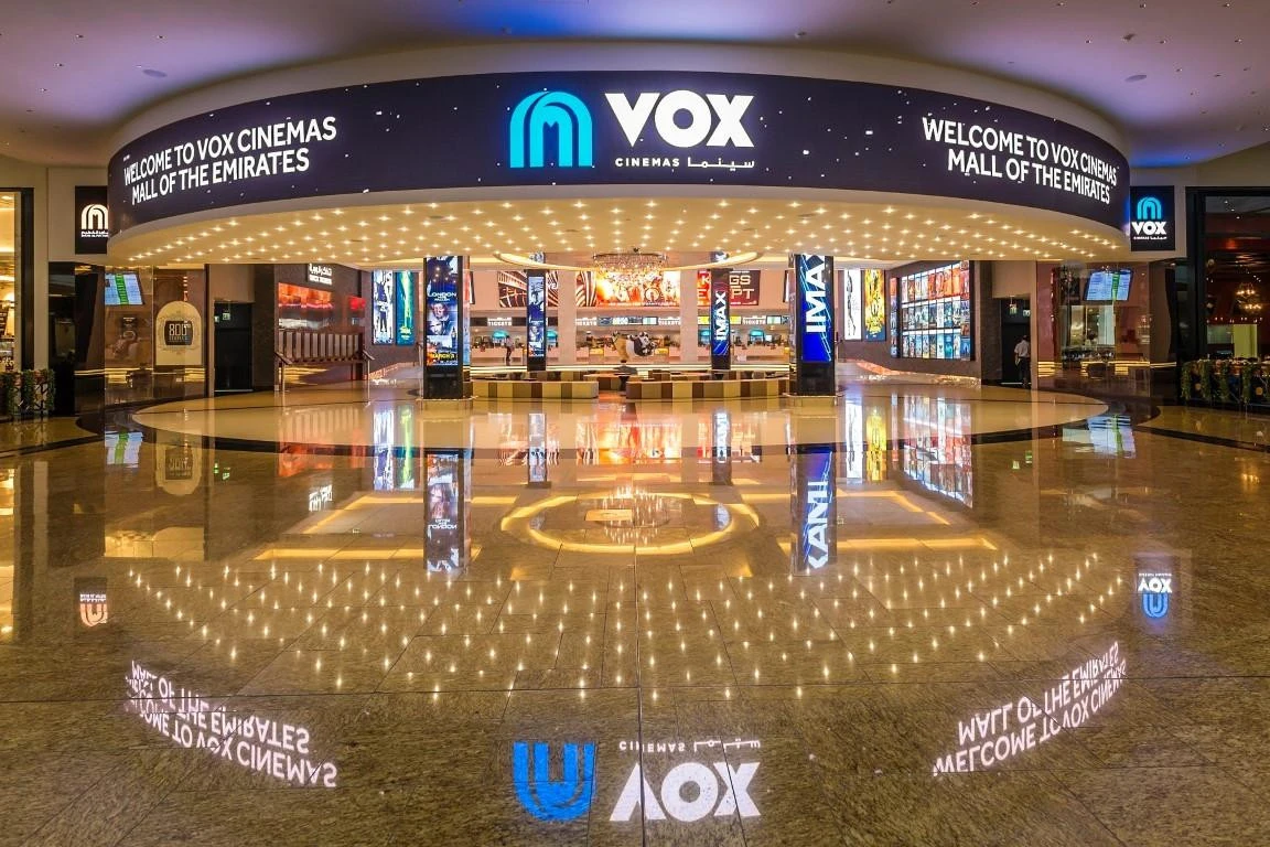 Entrance of VOX Cinemas at City Centre Mirdif, Dubai, illuminated.