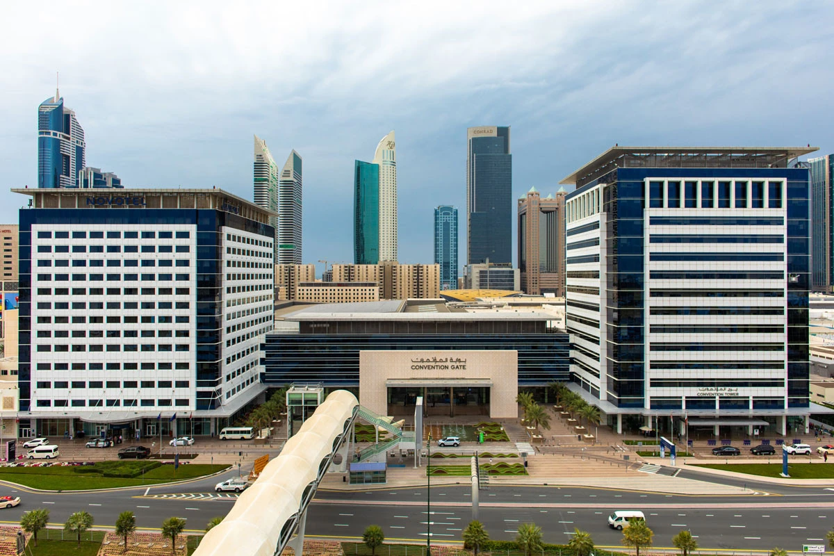 Dubai World Trade Centre with city skyline in background.