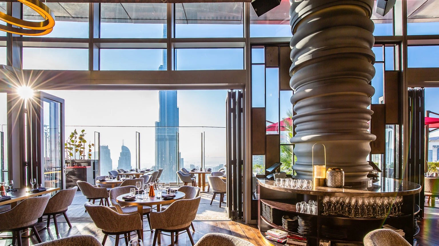 CÉ LA VI Dubai restaurant with Burj Khalifa view, elegant interior design.