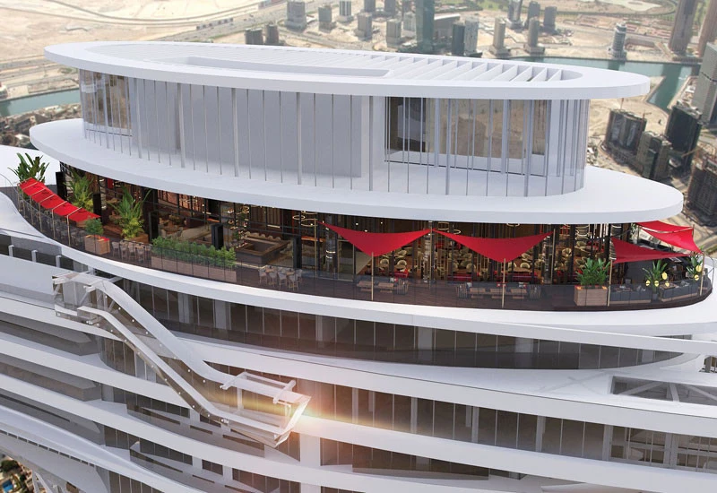 CÉ LA VI Dubai rooftop with red canopies and city view.