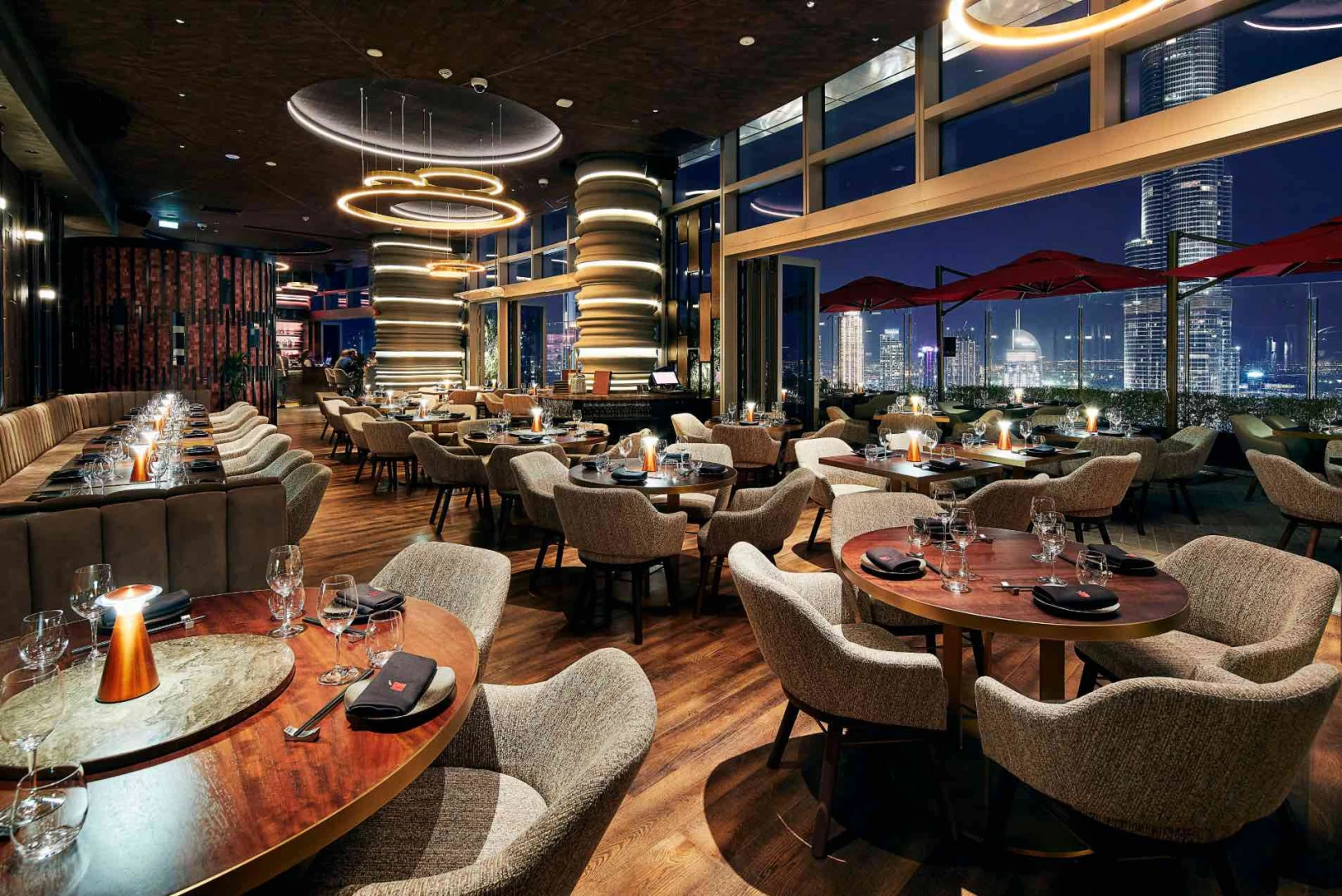 Elegant dining area at CÉ LA VI Dubai with city skyline view.