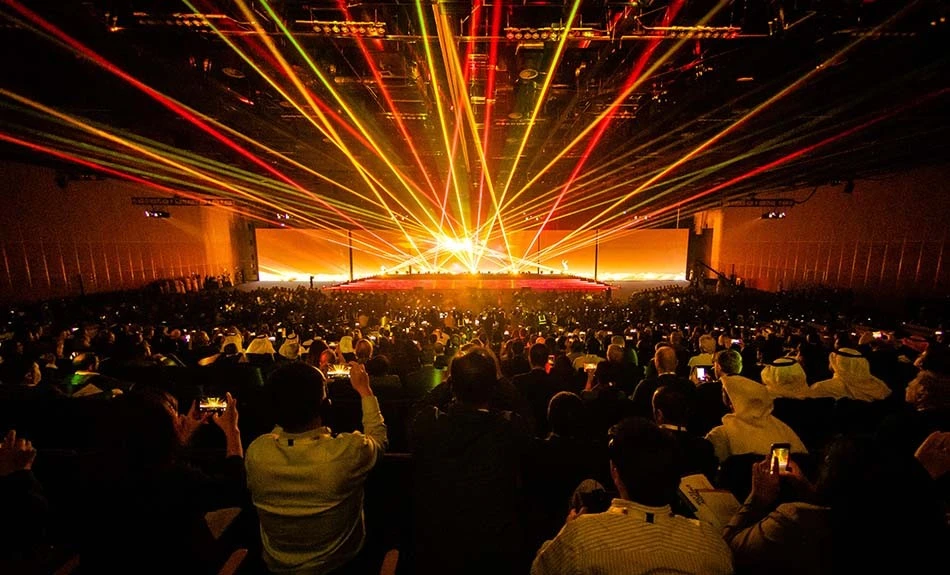 Audience enjoying vibrant light show at ADNEC Centre Abu Dhabi