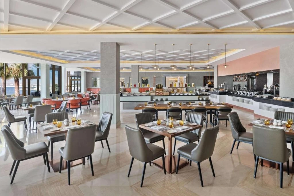 Spacious dining area at JA Beach Hotel, Dubai, with elegant decor.