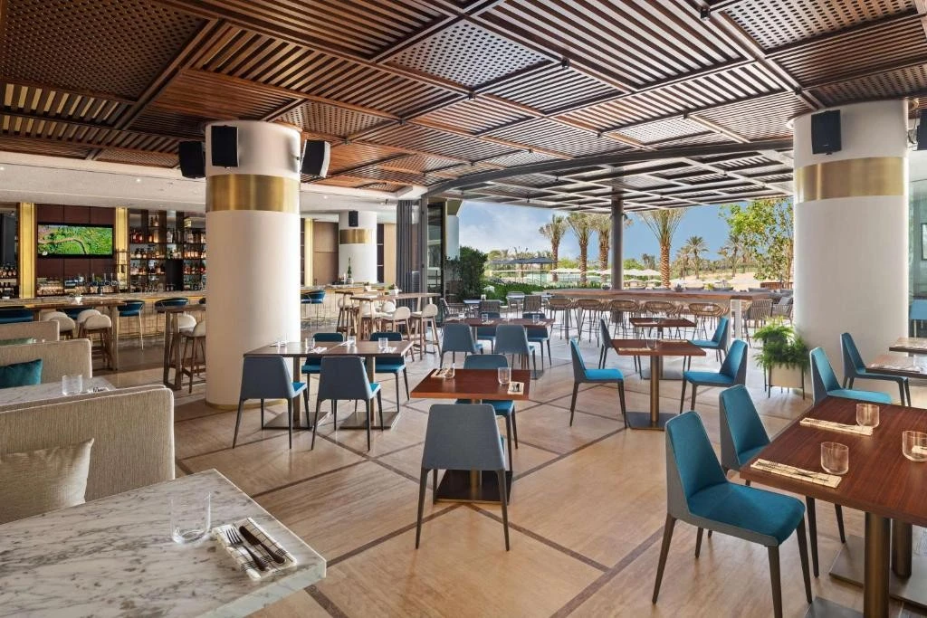 Elegant dining area at JA Beach Hotel, Dubai with outdoor view.