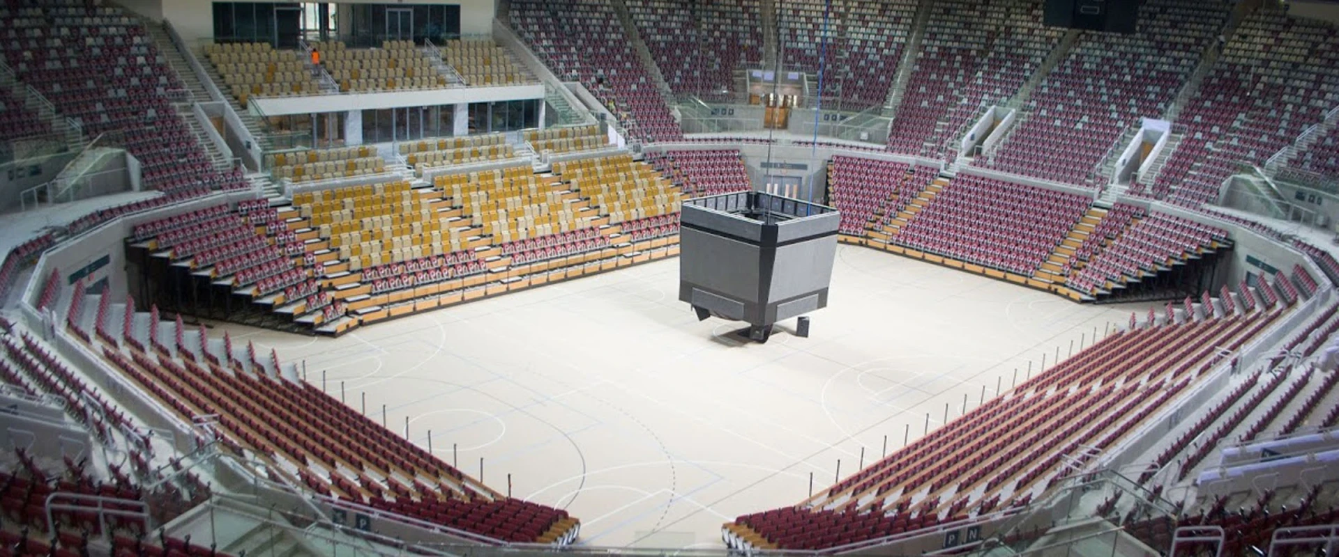 Spacious indoor arena with tiered seating at King Abdullah Sport City.