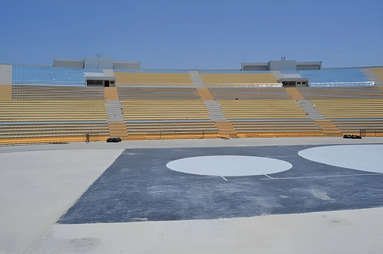 Empty Asian Town Amphitheater seating area under clear sky, Doha.