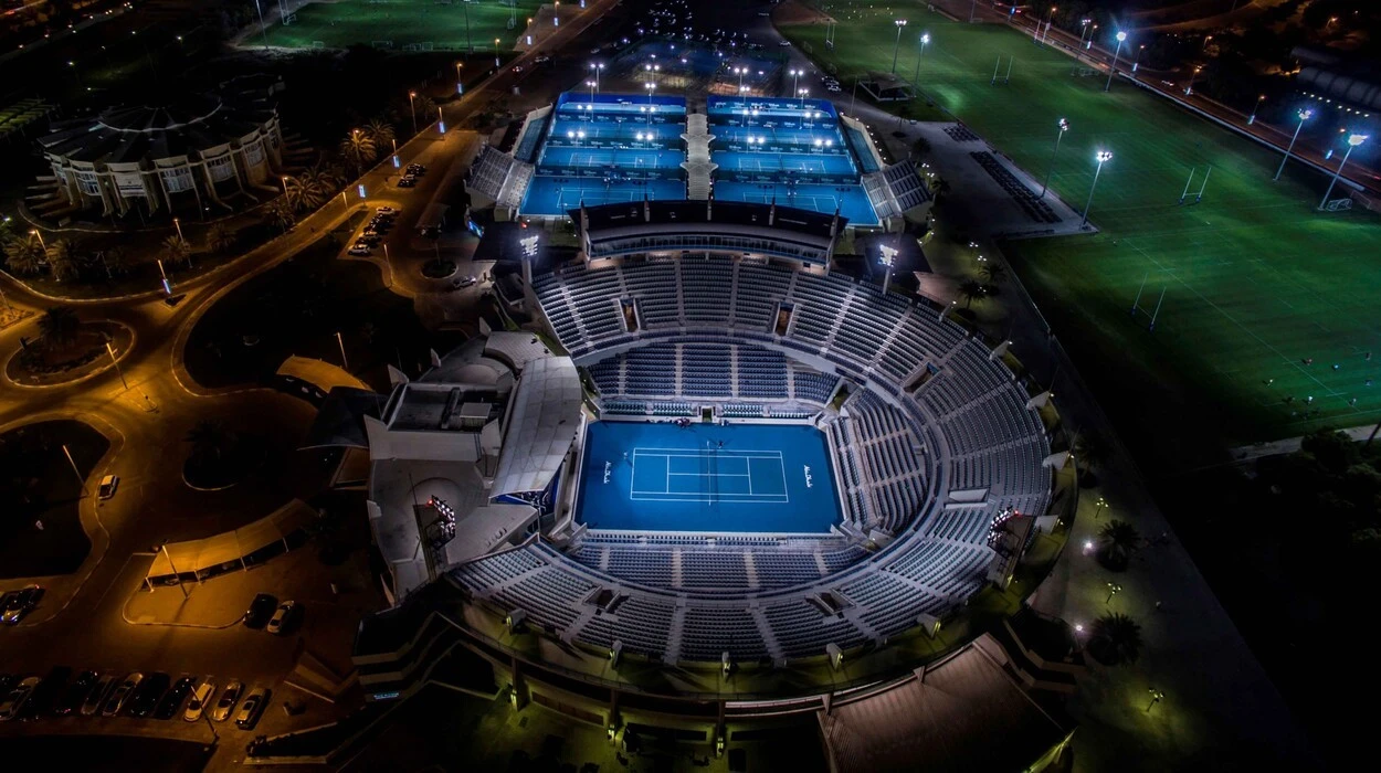 Aerial view of Zayed Sports City stadium at night, Abu Dhabi.