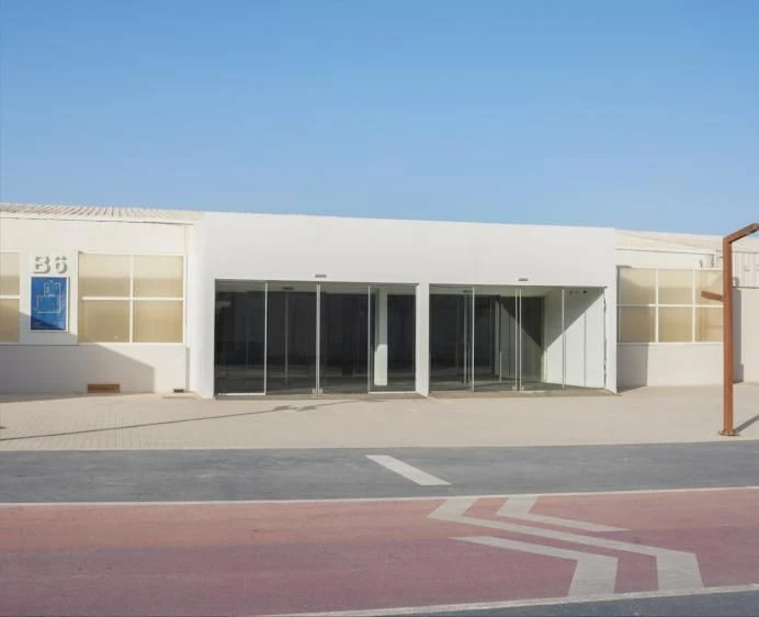 Jax District Riyadh exterior, modern glass entrance, Dubai venue.
